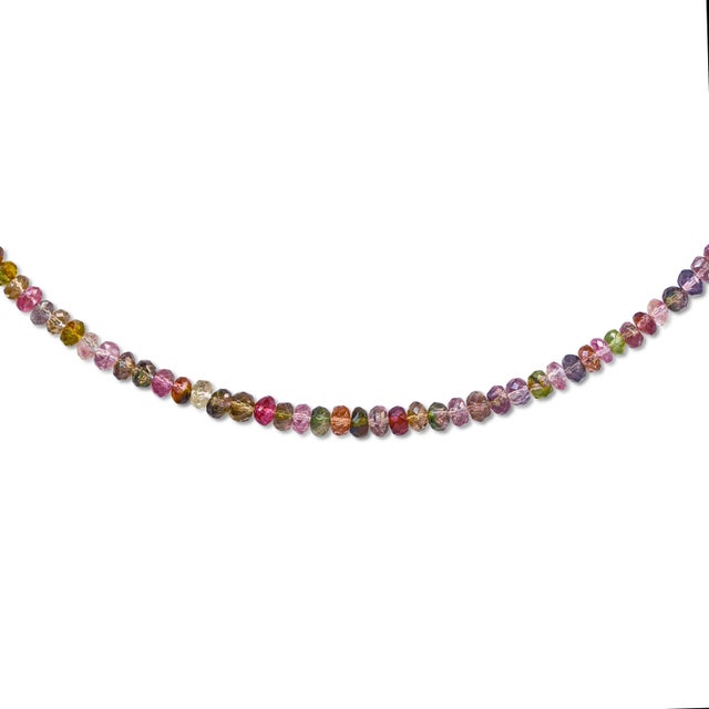 Every color tourmaline produces, strung in one place. Pink, green, olive, violet, rust, blue faceted rondelles that shift...