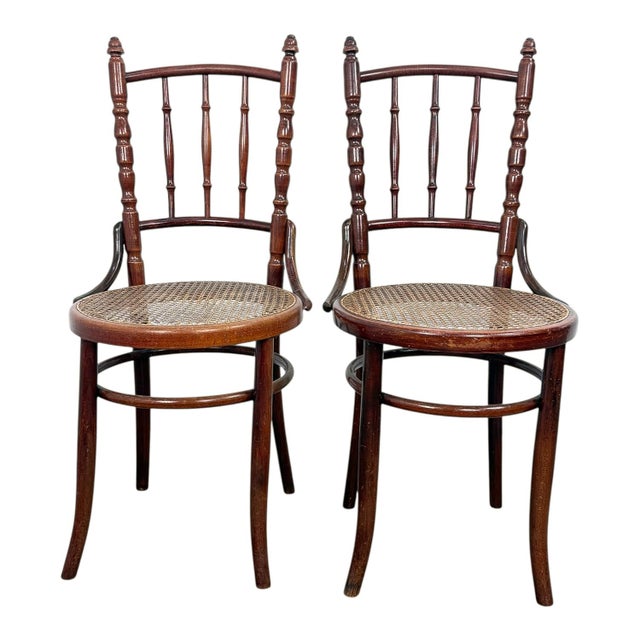 Elegant set of two antique bentwood café chairs by Fischel, retaining the original paper manufacturer’s label beneath the...