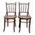 Elegant set of two antique bentwood café chairs by Fischel, retaining the original paper manufacturer’s label beneath the...