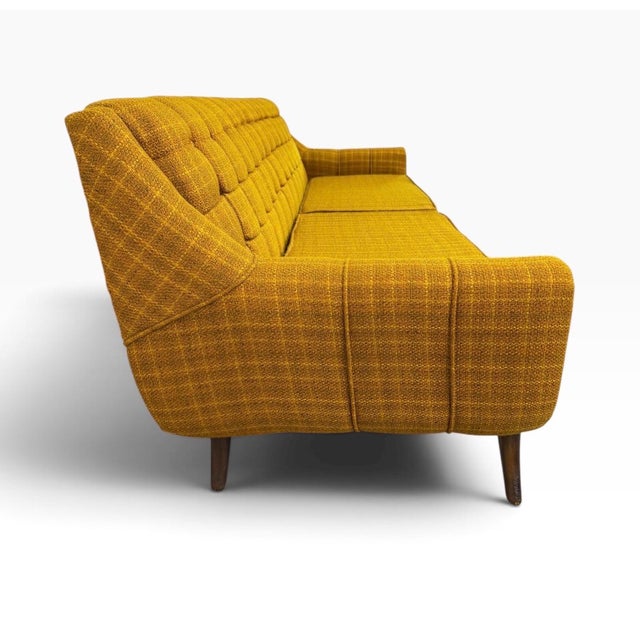 A striking example of 1960s Mid-Century Modern design, this matching sofa and armchair set combines sculptural form with...