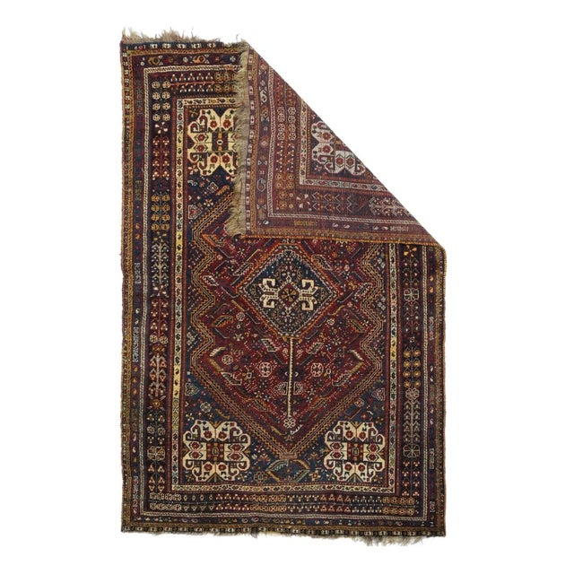 Fars province, SW Persian, with a dep blue field, four elaborate knot-medallions in the corners, and a central "Qashghai...