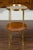 An English mahogany tiered oval table from the mid-20th century, with brass accents. Born in England during the midcentury...