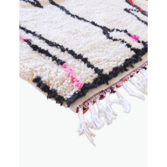 Contemporary Azilal Moroccan Rug – Abstract Symbols with Neon Accents This contemporary Azilal Moroccan rug is an...