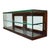 This antique country store display case, dating to approximately 1910, features a robust oak frame with beveled glass...
