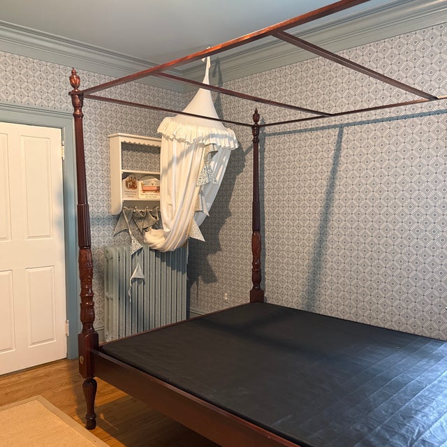 This is a gorgeous vintage queen size solid mahogany four poster bed with fluting and rice carvings. Age is approximately...