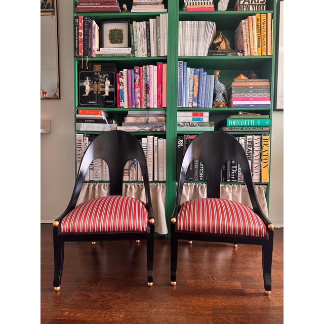 Pair of Regency Black Spoon Back Chairs upholstered in striped orange/ navy blue and brown stripes with brown trim....