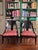 Pair of Regency Black Spoon Back Chairs upholstered in striped orange/ navy blue and brown stripes with brown trim....