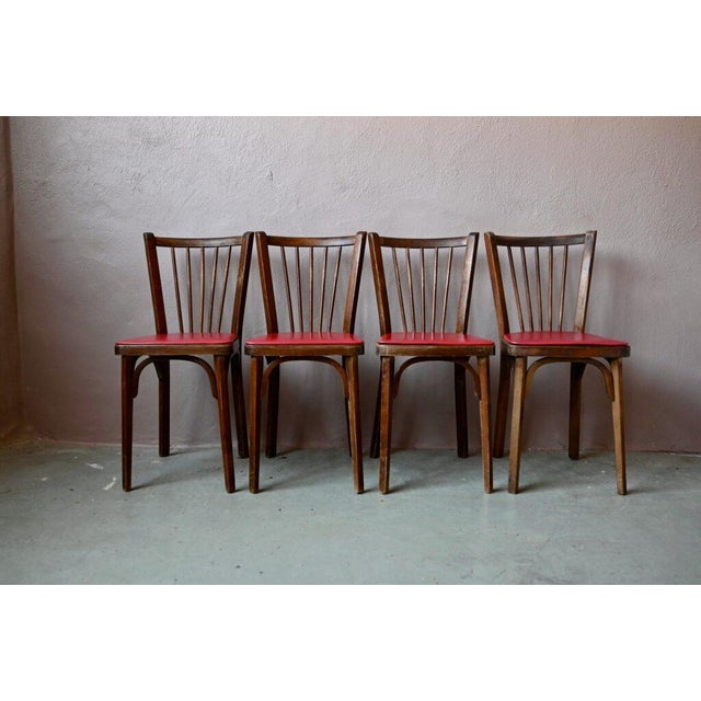A lovely set of four bistro chairs by Baumann. This retro classic still holds its charm. The contrast of materials and...