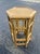 Charming vintage bamboo and woven cane side table featuring a distinctive hexagonal top and architectural openwork frame....