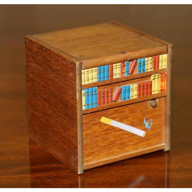 Folk Art musical Cigarette or Cigar dispenser circa 1970’s that features a rising dog. The condition is good and used, as...