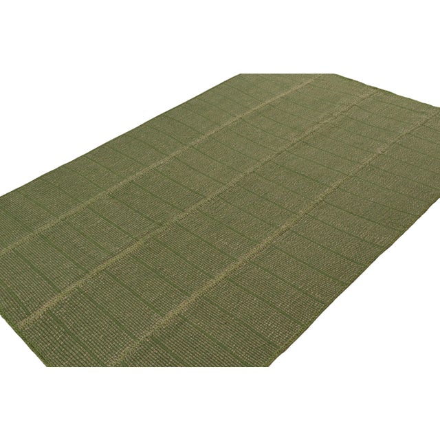 Handwoven in wool, a 6x9 Kilim in Green with Beige accents, from a bold new line of contemporary flatweaves, ‘Rez Kilim’,...