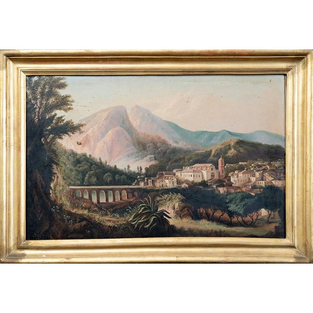 A pair of antique oil-on-canvas paintings with period frames depicting a view of the Church of San Francesco and the...