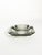 French glass ashtray dating from the 1970s, featuring a substantial geometric form in smoky grey glass. The thick molded...