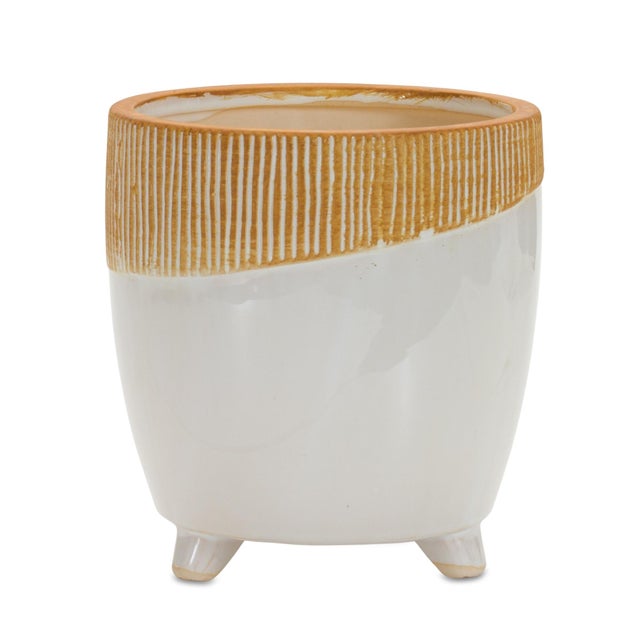 Add a modern earthy touch to your home with this Dual Tone Terra Cotta Planter. Featuring a stylish color block design in...