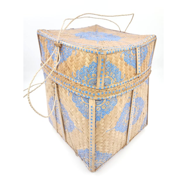 A striking large woven storage basket crafted by hand in Bali, featuring natural buri bamboo construction and bold hand-...