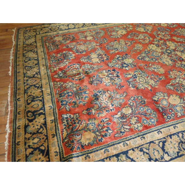A rare size vintage Persian Sarouk carpet. Measures: 5'4'' x 8'.