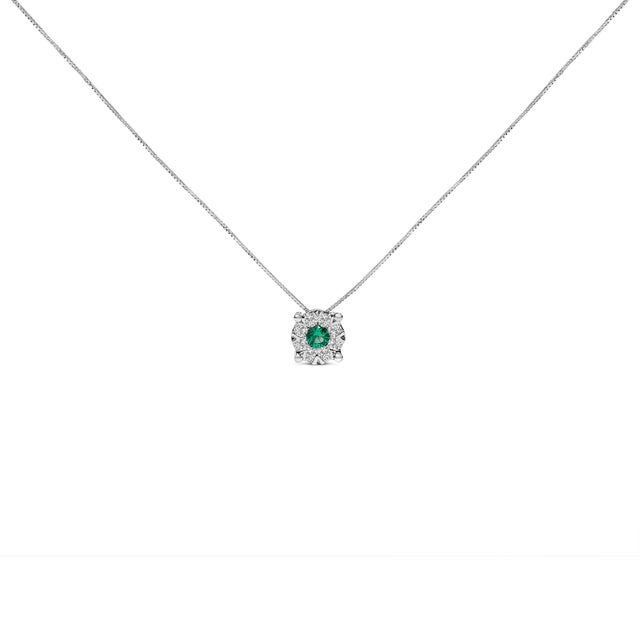 Draped in the elegance of 14K white gold, this pendant necklace is a masterpiece designed to captivate and charm. At its...