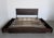 This is the Logan King Storage Bed by West Elm, a modern platform bed that blends form and function with clean lines, rich...