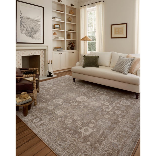 The Louisa Collection is a serene area rug based on beautiful, traditional Turkish designs updated in calm colorways by...