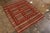 Hand woven circa 1980, this vintage Kilim enjoys a play of embroidery and flat weave technique, creating the subtle high-...