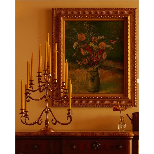 Elegant and substantial vintage brass candelabra featuring multiple scrolling arms arranged in a tiered design. This...