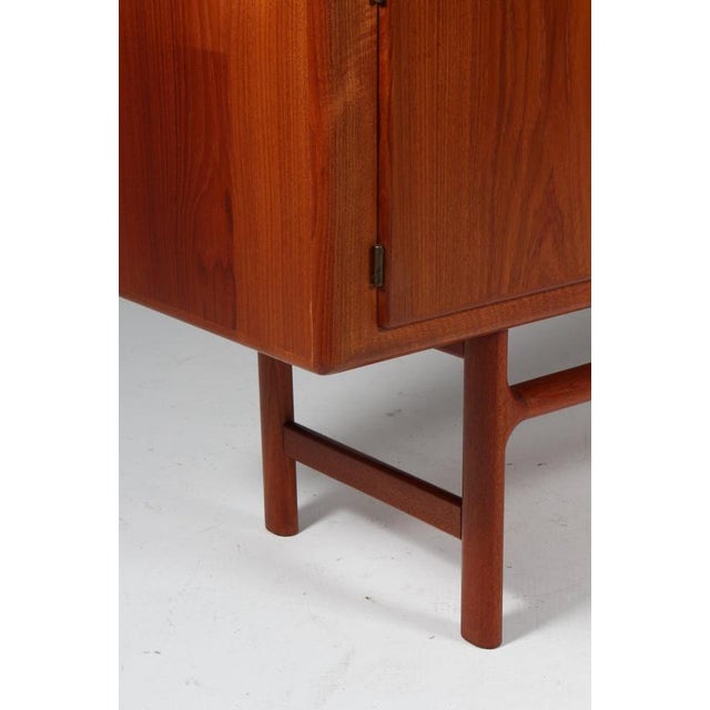Danish Cabinetmaker sideboard in teak. Sliding doors, drawers and doors. Made in the 1960s This piece is attributed to the...