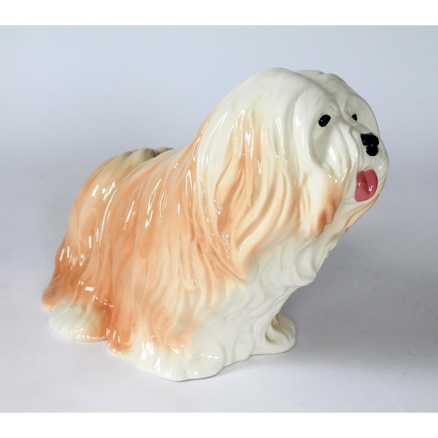 Large vintage ceramic Lhasa Apso dog figure. Dated 1987. Initials by artist on bottom. One small chip. Pictured.