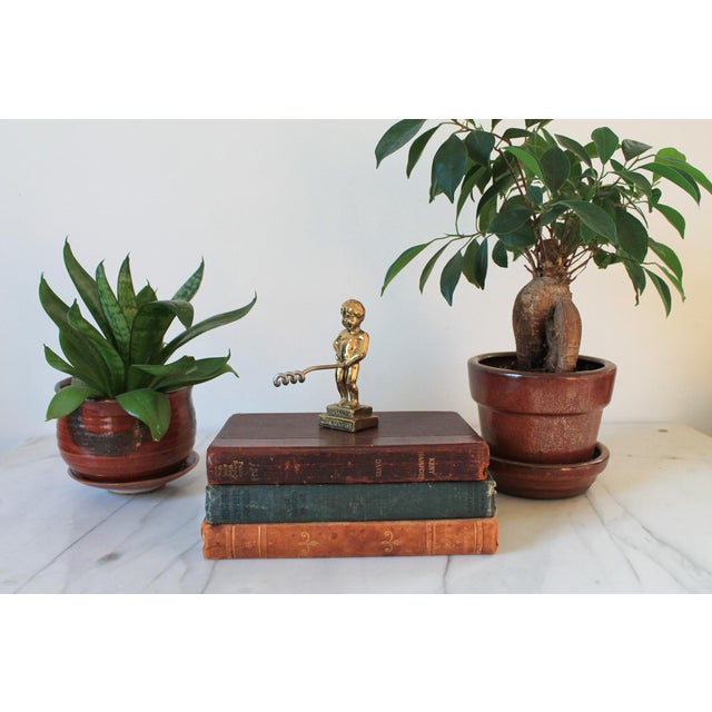 Vintage brass "Bruxelles Manneken Pis" wine bottole opener. Minor age wear.