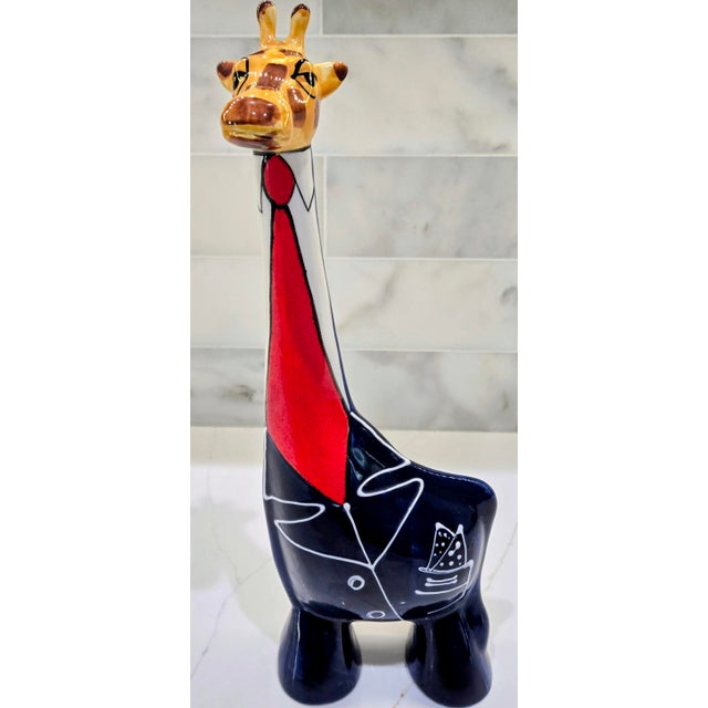 Offer a rare, limited edition Anatoly Turov art ceramic giraffe sculpture, hand-painted in 1999 and bearing the original...