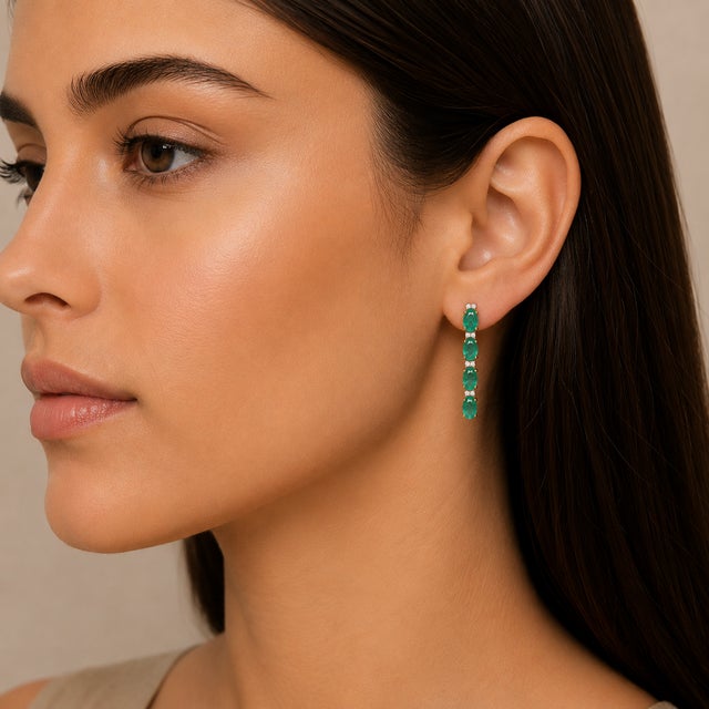 This is part of Chairish’s Fine Jewelry assortment. Emerald Long Hanging Earrings in 14K Gold to make a statement with...