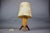 Vintage ULUV table lamp manufactured in Czechoslovakia during the 1960s. The lamp features a sculptural wooden tripod base...
