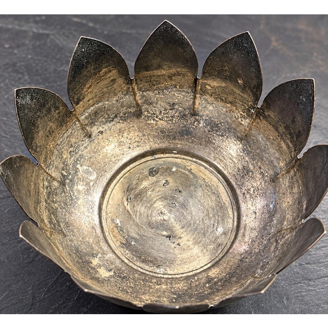 Beautiful vintage silver-tone metal lotus bowl featuring gracefully curved, pointed petals and a classic pedestal base....