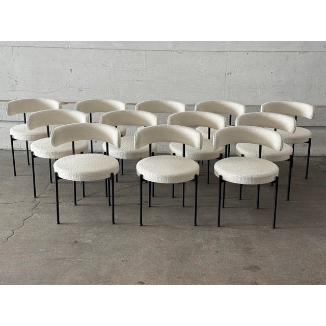 Design Plus Gallery presents a Set of Twelve Inesse Dining Chairs by Omar De Biaggio for CB2. These ivory dining chairs...