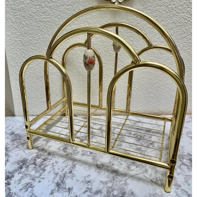 Vintage 1970s arched brass magazine or wood decor storage rack with enamel floral accents.