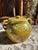 A richly glazed mid-century USA pottery lidded sugar bowl, featuring a warm mustard base layered with organic mossy green...