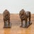 A pair of contemporary bronze lion sculptures on bases, with dark patina. Created with the traditional technique of the...