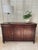 This classic British Colonial sideboard / buffet is made by Ethan Allen. Crafted from maple in warm Cinnabar stain with...