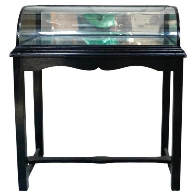 A superb Victorian shop display cabinet constructed from ebonised oak and distinguished by its elegant bow-fronted glazed...