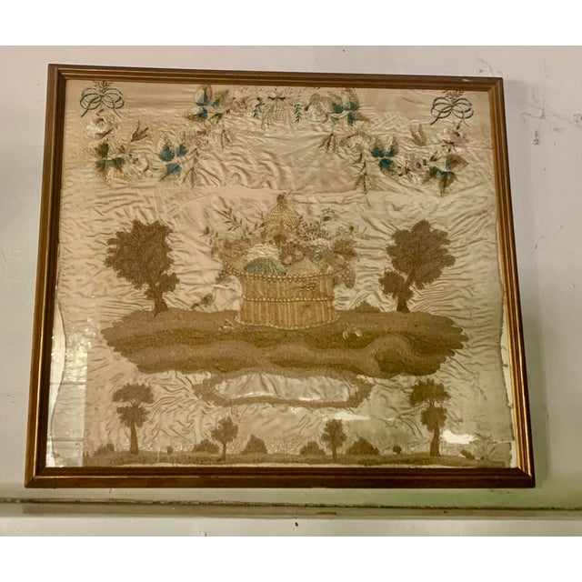 An impressive and substantial early American needlework sampler executed in silk on a silk ground. This piece features the...