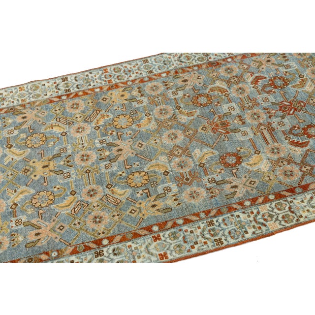 Elevate your hallway, entryway, or kitchen with this exquisite antique Oriental rug runner. Expertly hand-knotted from...
