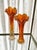 Lovely pair of mid century swung vases. Carnival glass iridescent shine and color variations from deep tangerine orange to...