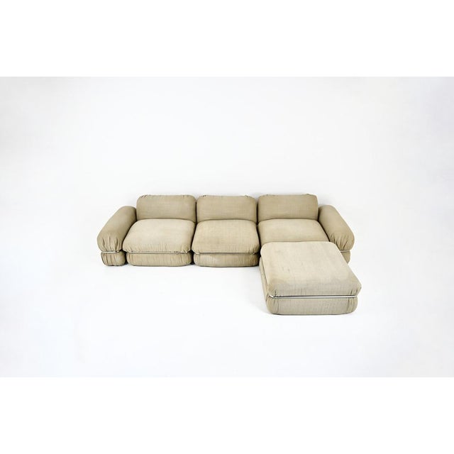 Fabric, metal, and plastic sofa. Fully modular. stamped on the underside of each piece. Dimensions of one piece: h: 62 cm...