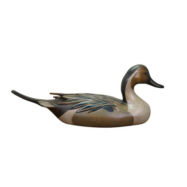 This beautifully preserved Northern Pintail Drake duck decoy is a classic example of Michigan artisan Bob Hayden’s master...