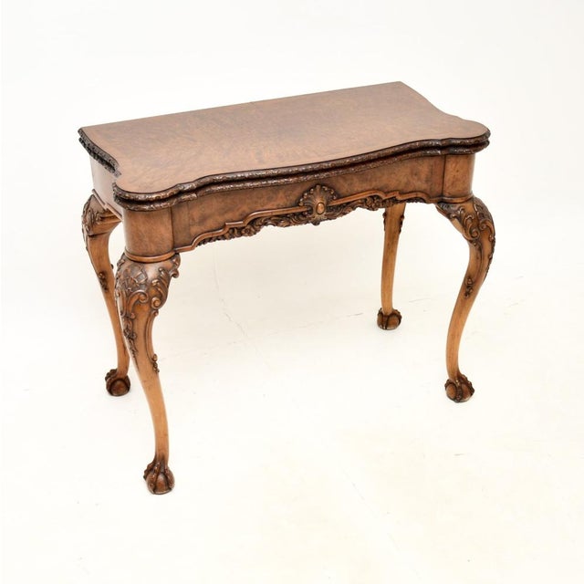 A fantastic antique burr walnut card table of the highest order. This was made in England, it dates from around the...