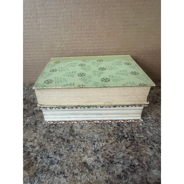 A handsome vintage set of Reader’s Digest Condensed Books featuring classic mid-century styling in green and black cloth...