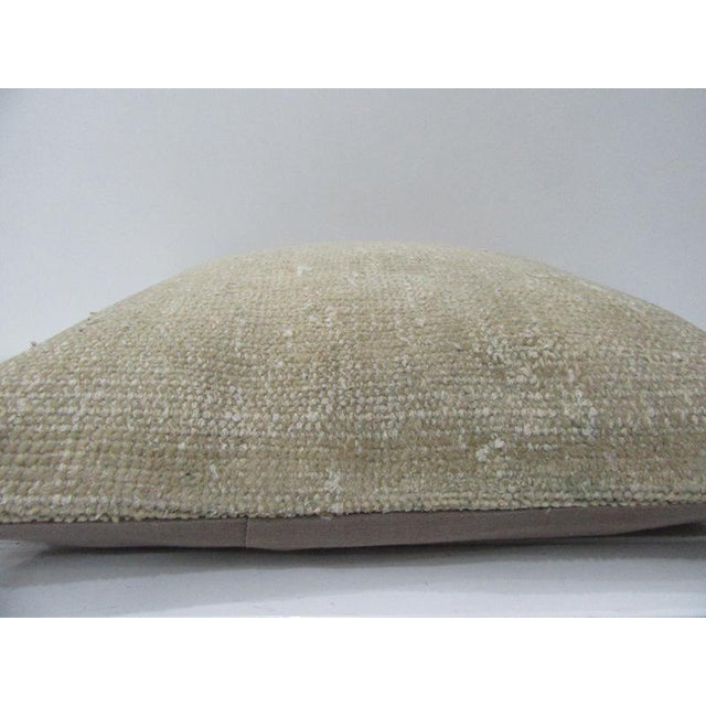 This is a pillow cover made from a vintage kilim rug. The piece was properly washed and ready to use. Pillow inserts not...