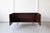 A lovely low cabinet in rosewood with attractive inset handles and chrome legs, ideally sized as a television stand. The...