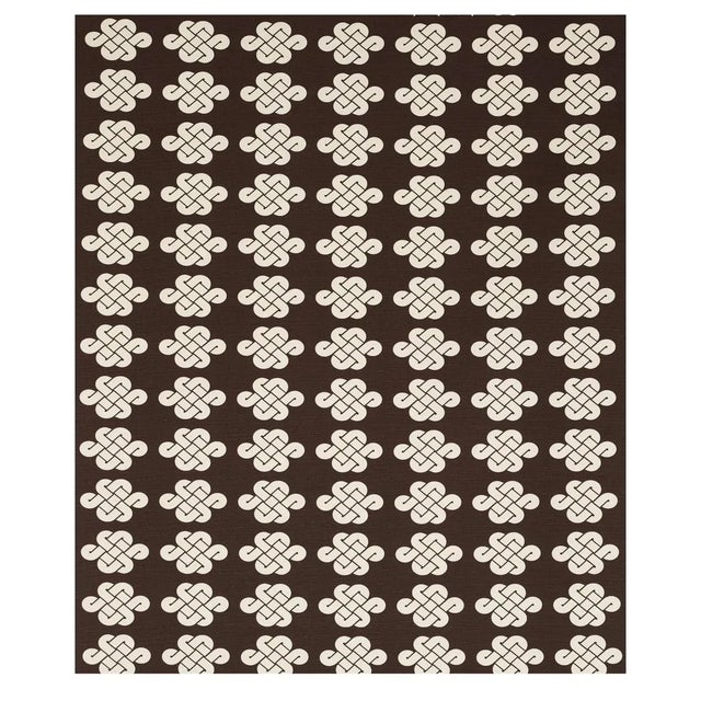 Glamorous, graphic, and preppy, Penelope Knot is a statement-making fabric featuring a Chinese good-luck knot from a...