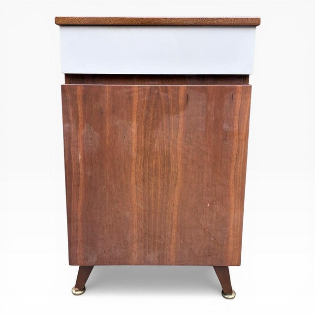 Stylish mid-century Meredew bedside cabinet, featuring the brand’s distinctive two-tone design with a warm wood carcass...