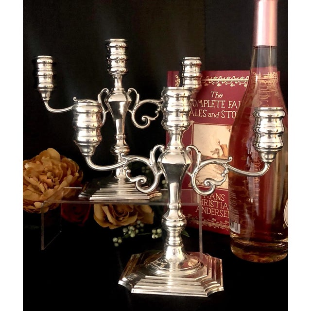 This is for a lovely pair of monogramed Sterling Silver Candelabras. They are from Pilgrim (Gorham) and each hold 3 taper...